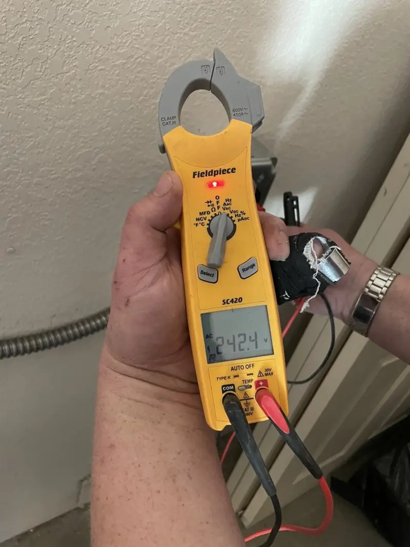 Voltage testing with clamp meter during Whole House Surge Protector in Destin